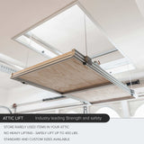 View of the platform fully raised, showing the clear space available for storing bulky items in the attic