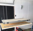 Close-up of the platform lifting mechanism, displaying the heavy-duty construction of the Auxx Attic Lift system
