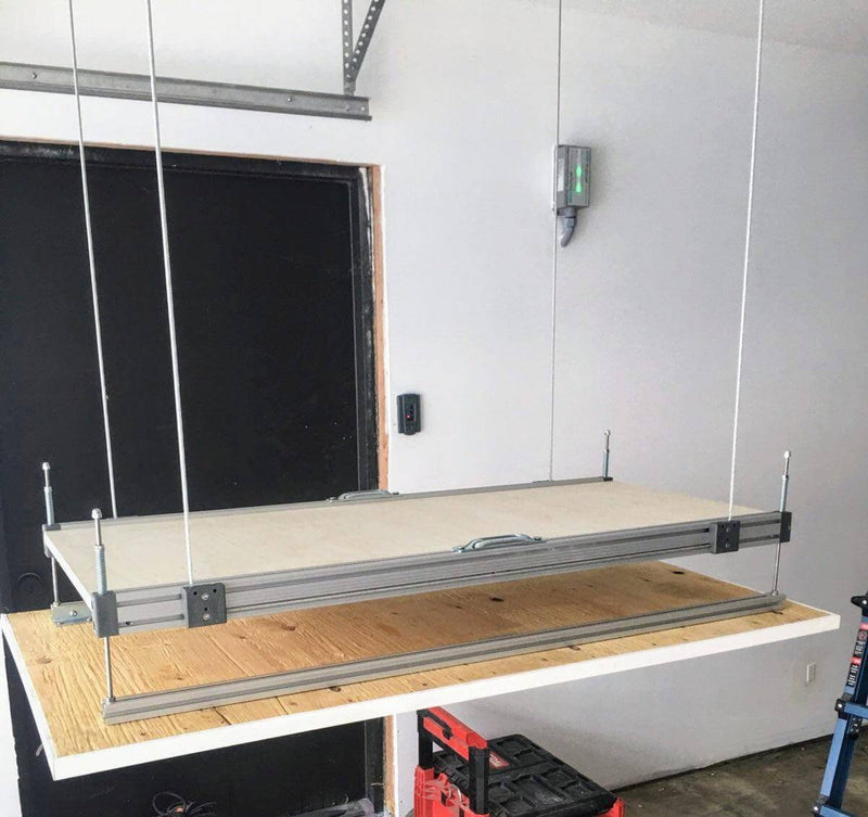 Close-up of the platform lifting mechanism, displaying the heavy-duty construction of the Auxx Attic Lift system