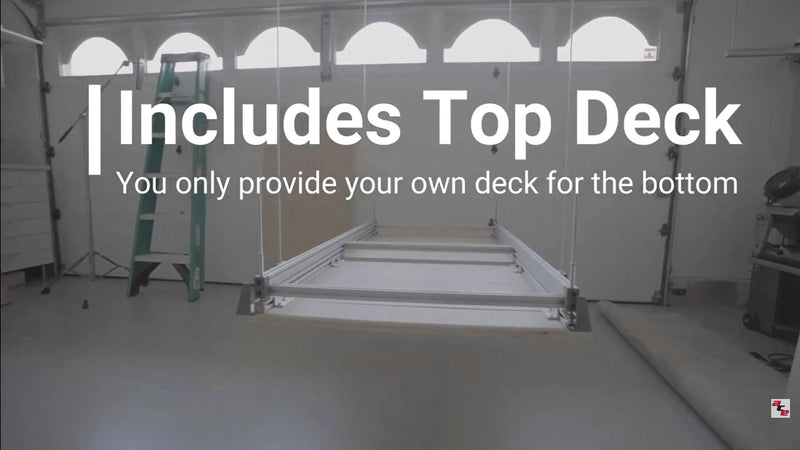 Wide shot of the Auxx Attic Lift in the lowered position, displaying the platform and its use in storing bulky items