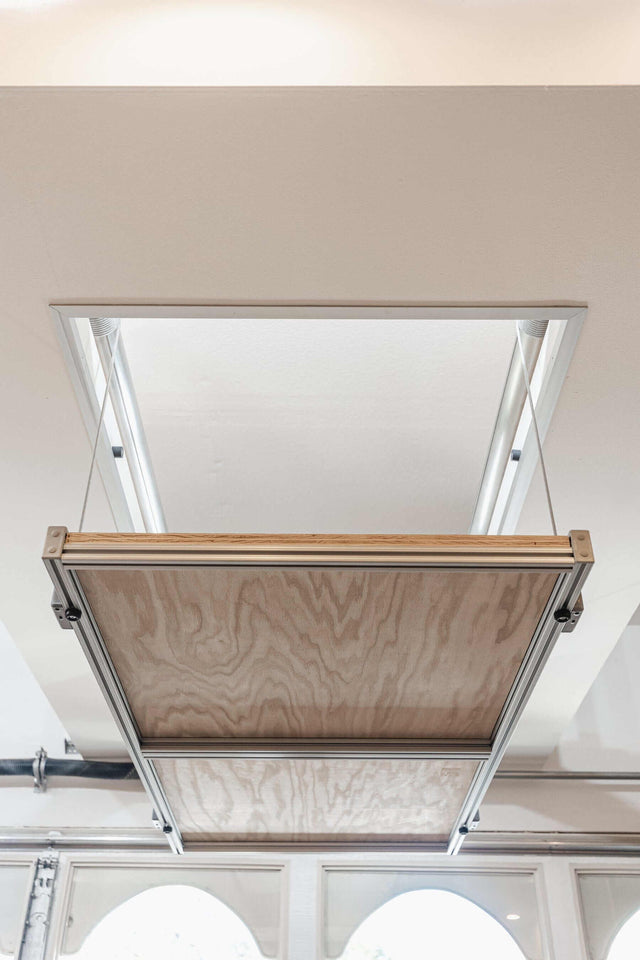 View of the Auxx Attic Lift system installed in a home, showcasing its robust lifting platform in a residential attic