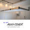 Angled view highlighting the textured, durable material of the Auxx Lift Cover in a garage setup
