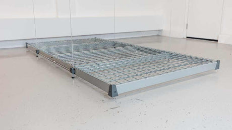 View of the Auxx Lift's wireless remote control, illustrating its user-friendly interface and programmable buttons