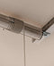Side view of the Auxx Lift installed in a garage, showcasing its compact design and efficient use of overhead space