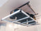 Close-up of the lift motor mounted on the ceiling, showing secure installation and wiring detail