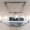 Angled side view of the Auxx Lift system raised near the ceiling, loaded with storage containers