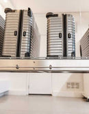 Garage scene with the Auxx Lift in lowered position, showcasing ease of access to stored items
