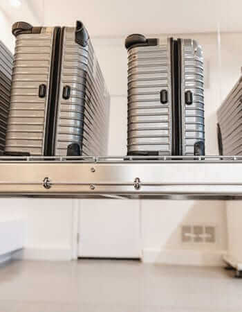 Garage scene with the Auxx Lift in lowered position, showcasing ease of access to stored items